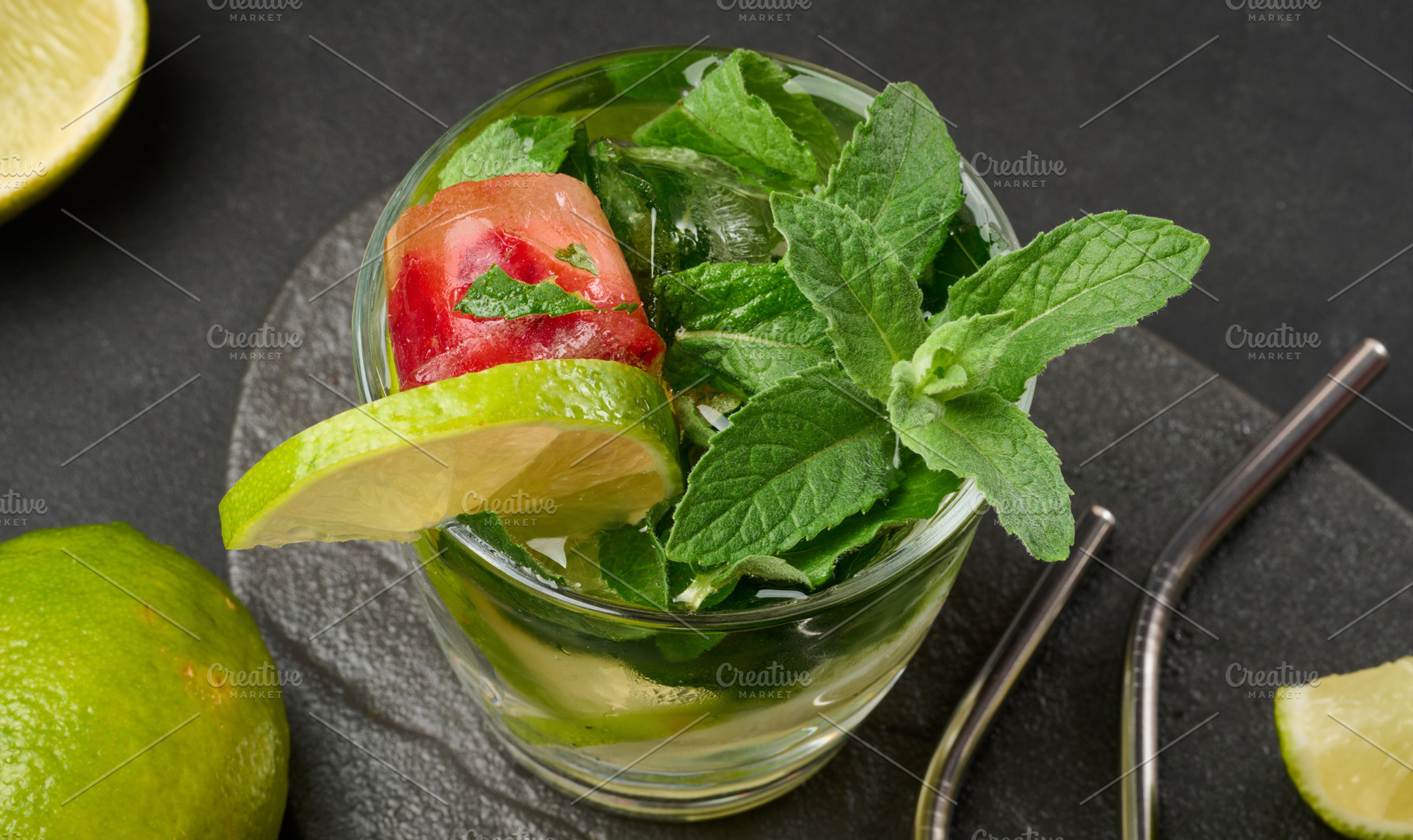 Refreshing mojito cocktail with lime, mint, strawberry, and ice, a Food & Drink Photo by ndanko