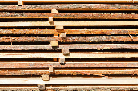 Stacked lumber background, an Industrial Photo by Artsaba Family