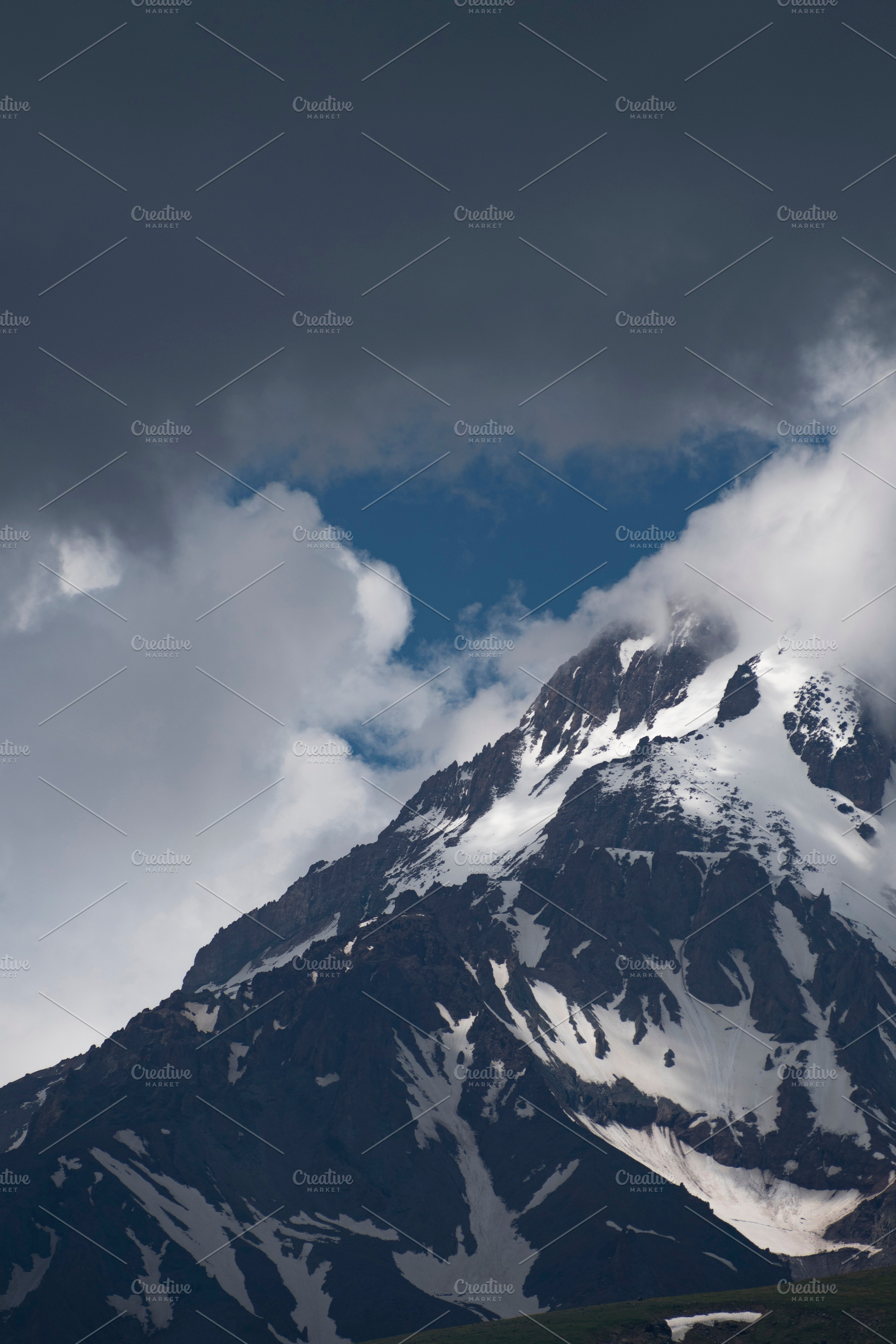 High Mount Kazbek slopes under dark storm clouds with blue sky p, a Photo by Pictures for you!!!!!!!!!