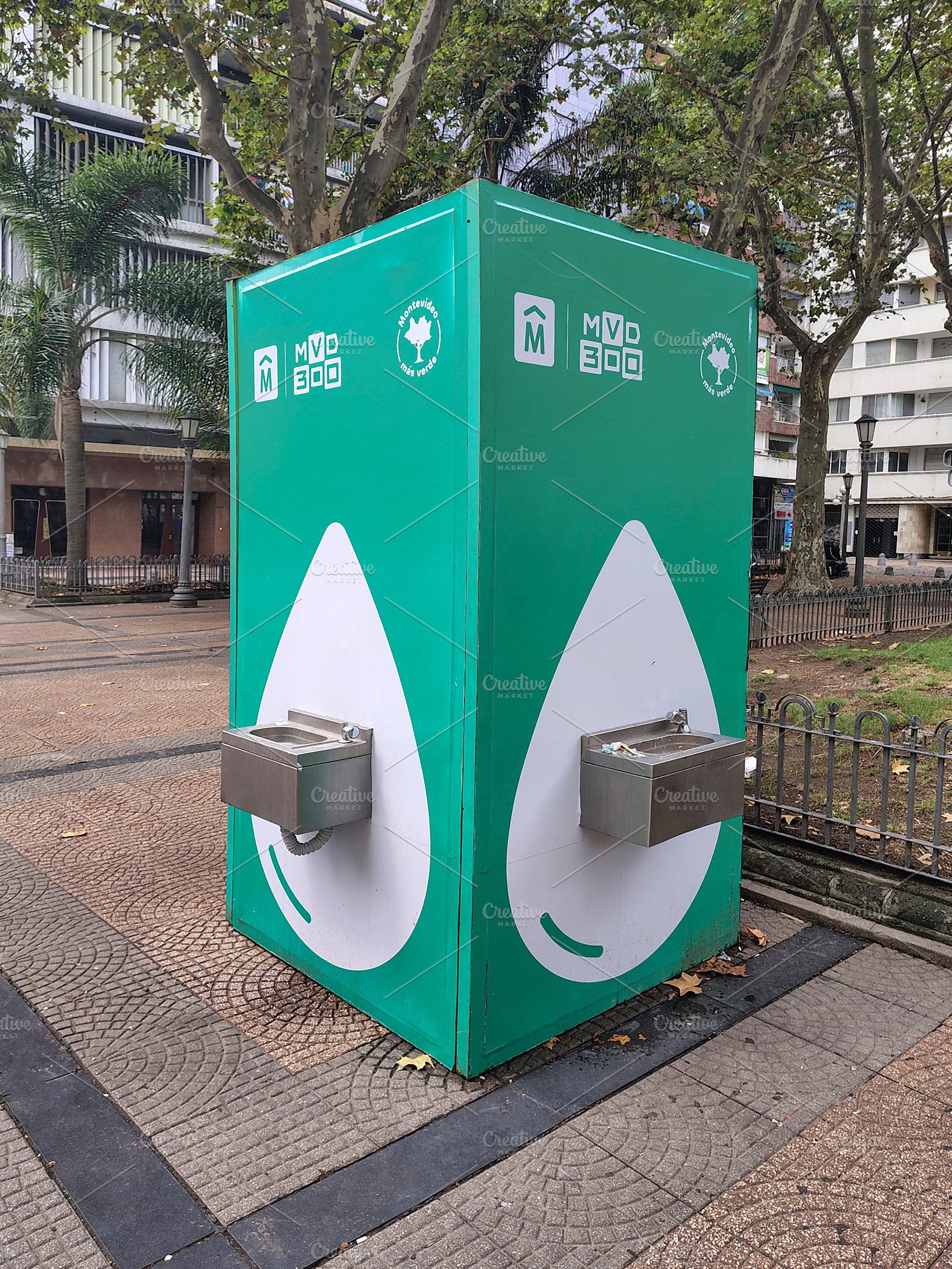 Water dispenser module on plaza cagancha sidewalk, montevideo, u, an Industrial Photo by DanFLCreativo