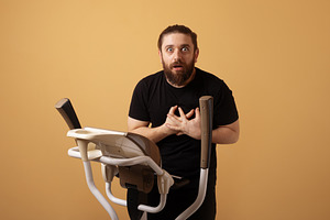 Surprised Man on Exercise Bike, a Person Photo by Ales Munt