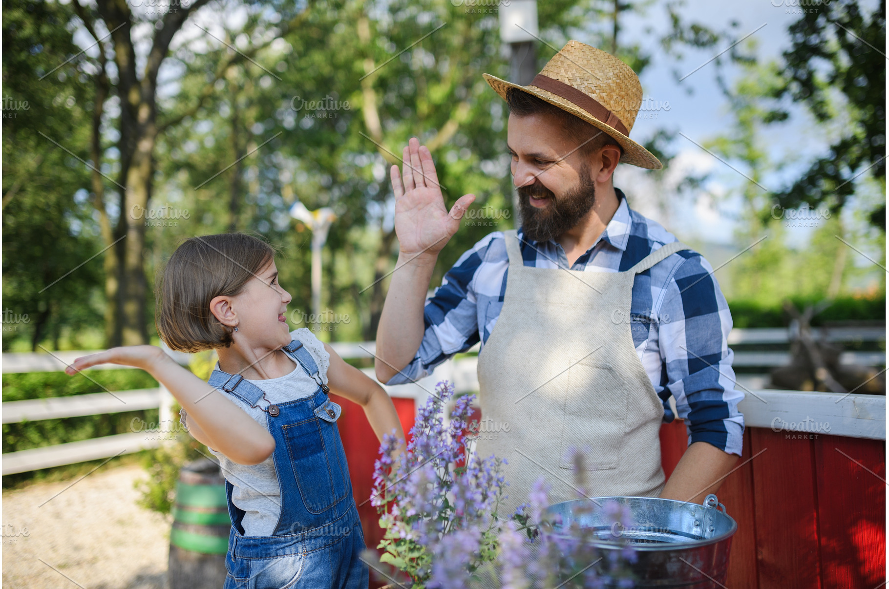Father and young daughter planting, a Nature Photo by HalfPoint