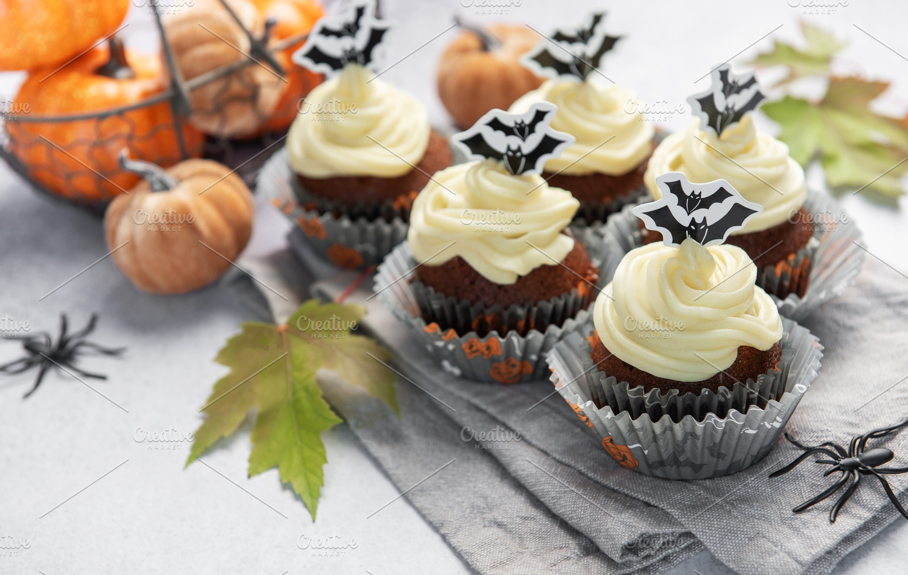 Halloween cupcakes with bat decoration and small pumpkins, a Food & Drink Photo by Olena Rudo