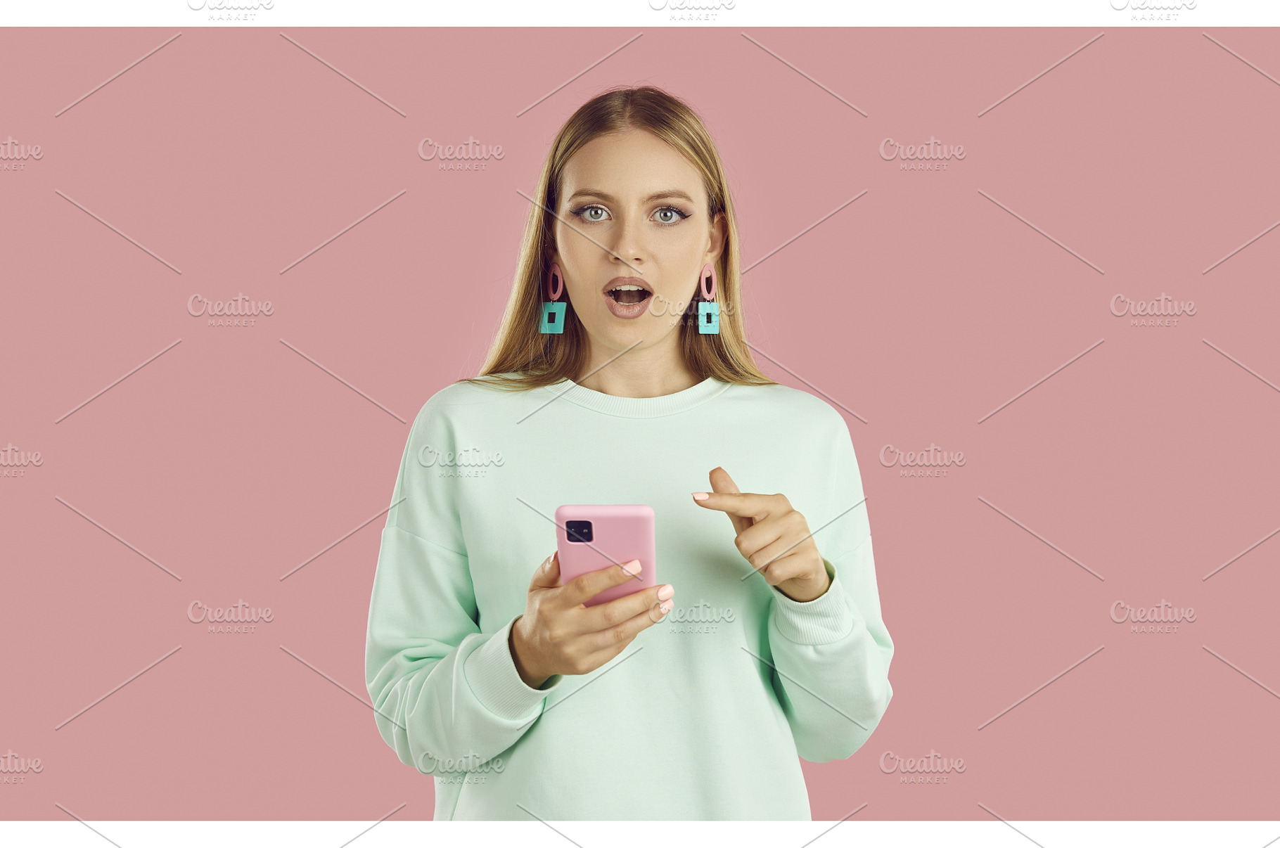 Woman with surprised expression sees, a Person Photo by StudioRomantic