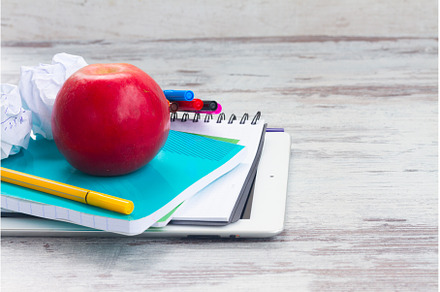 Apple with school supplies, a School & Education Photo by Neirfy