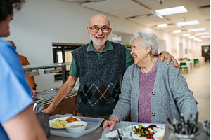 Elderly couple having lunch in, a Person Photo by HalfPoint