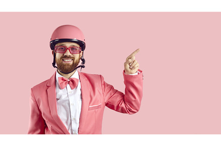 Funny man in pink bike helmet, suit, a Person Photo by StudioRomantic
