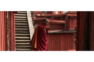 Tibetan Buddhist Monk in Red Robes, an Architecture Photo by piter.goskov