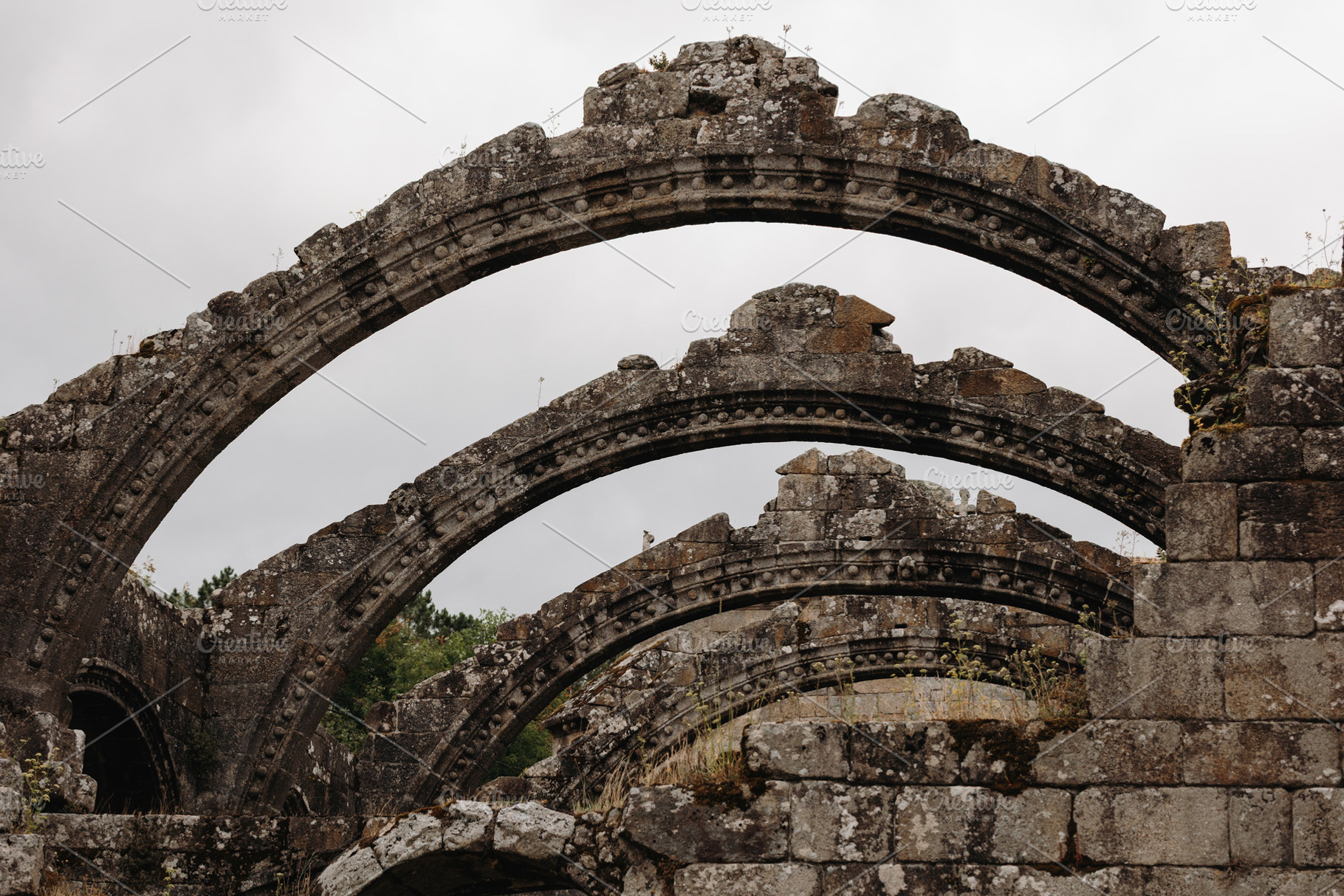 Ruins of medieval stone arches in an, an Architecture Photo by Perpis