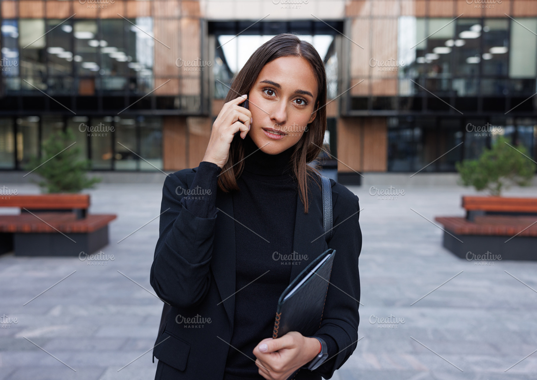 Young woman talking on mobile phone, a Business Photo by Artem Varnitsin