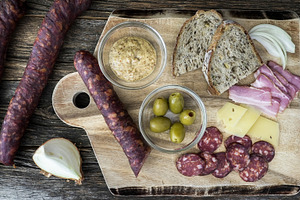 Sausages, cheese, and bread on a woo, a Food & Drink Photo by 1miromiro