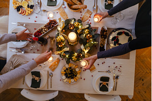 Top view of family preparing table, a Holiday Photo by HalfPoint
