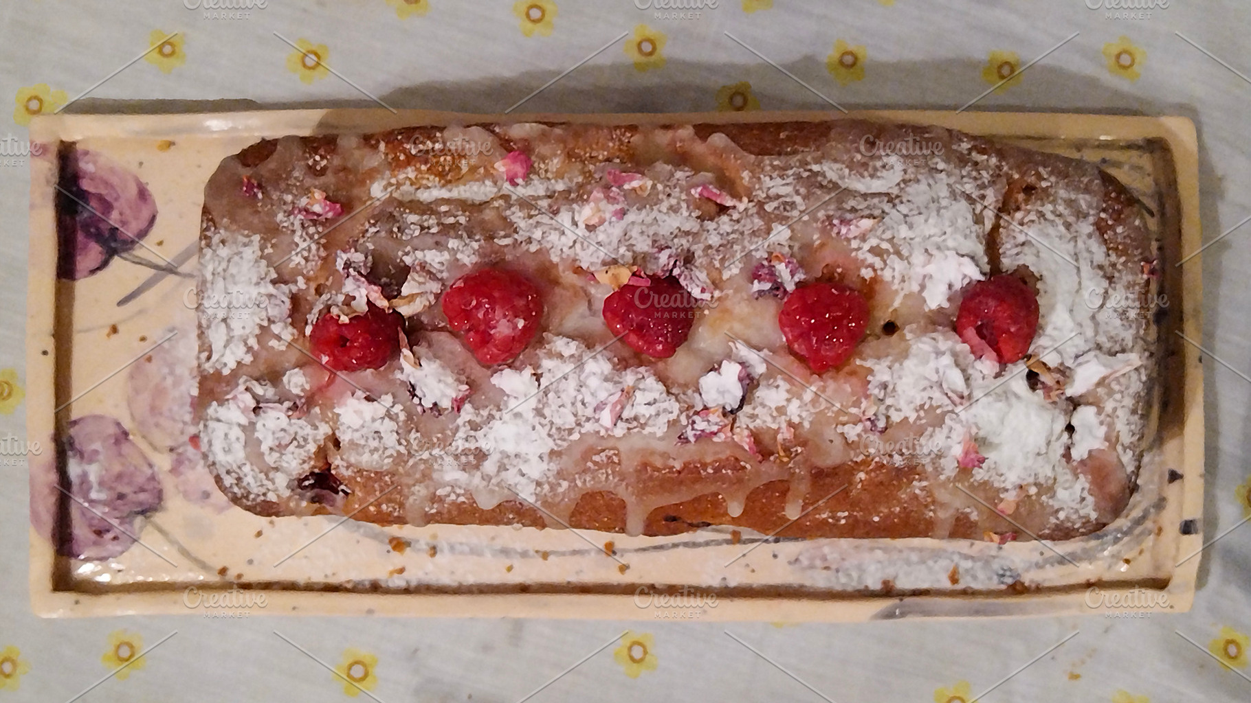 Cake with a golden-brown crust, topped with powdered sugar and r, a Food & Drink Photo by DanFLCreativo