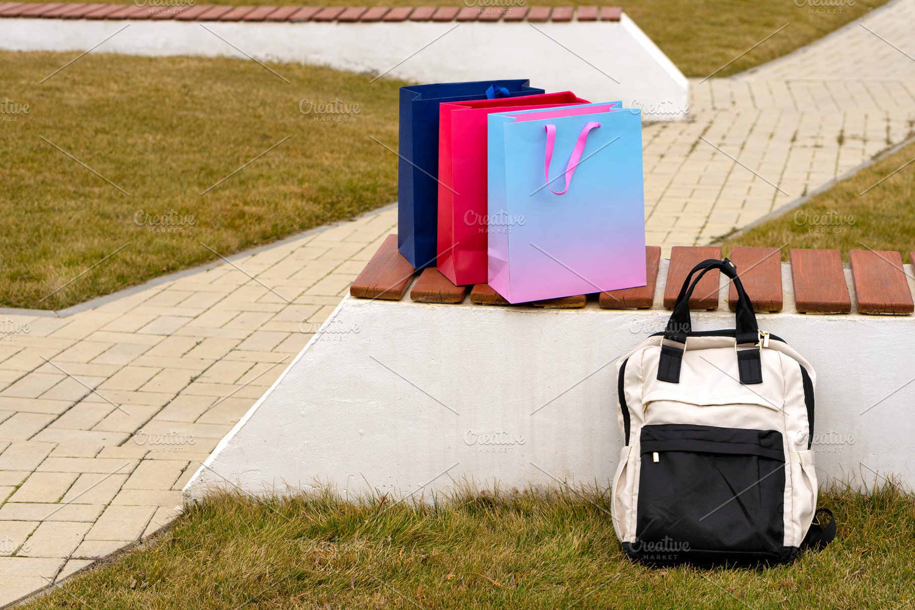 Three shopping bags and backpack, a Background Photo by Elena Vagengeim