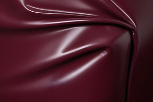 Deep maroon fabric draped elegantly on a surface, showcasing smooth texture and, a Background Photo by Kzara Visual Concepts