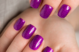 Bright festive purple manicure on female hands. Nails design, a Beauty & Fashion Photo by KOBRIN|PHOTO