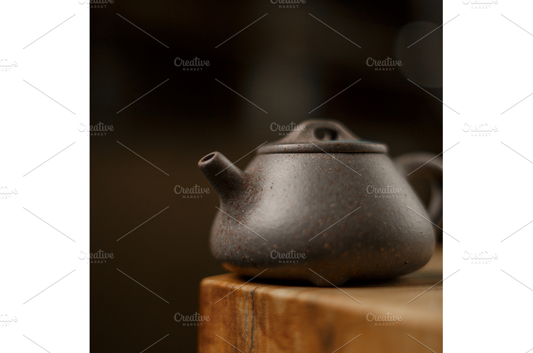 An Elegant Dark Teapot Placed on a, a Background Photo by Media Whale Stock