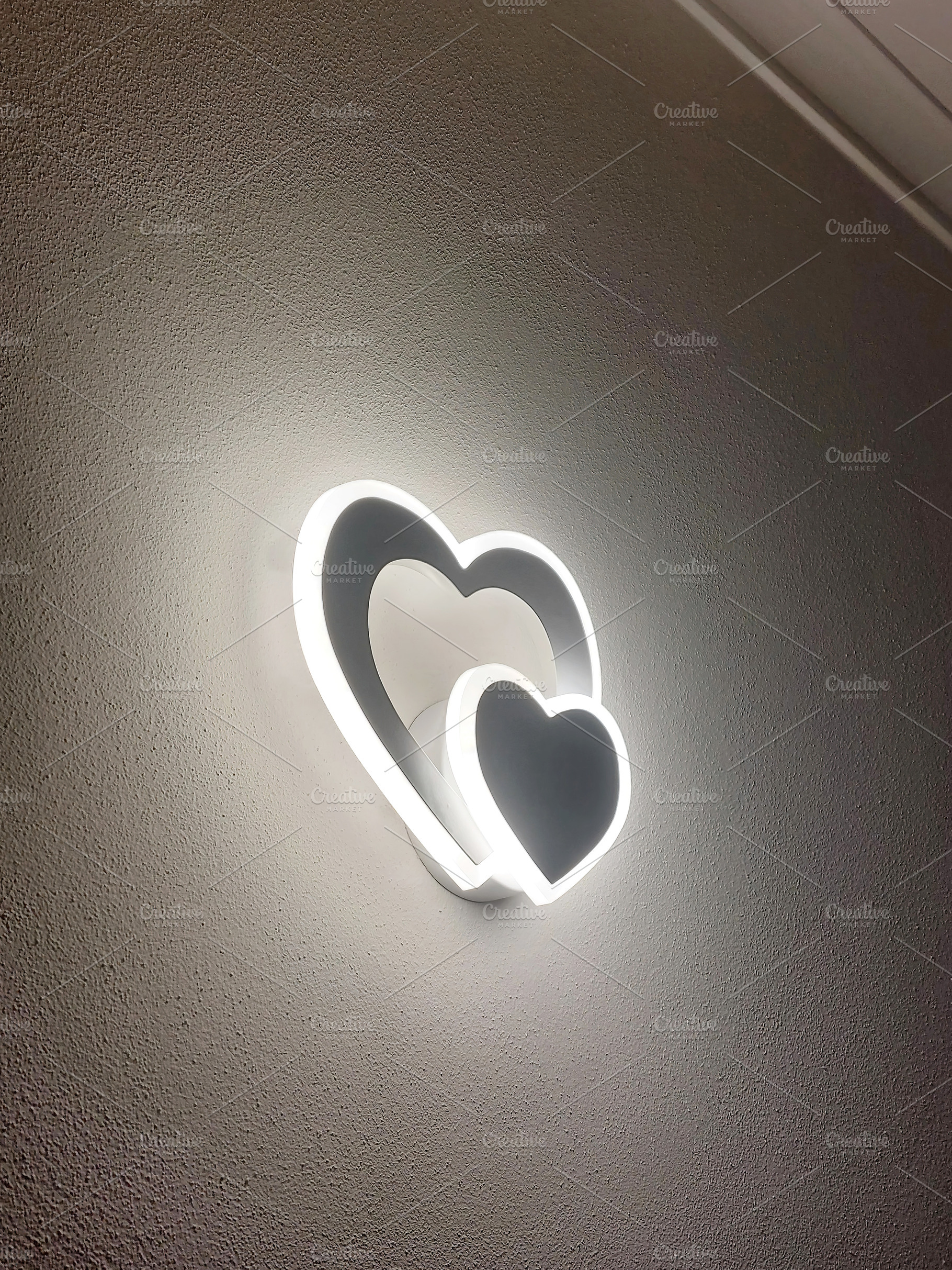 Heart shaped led wall lamp illuminating a textured wall, an Architecture Photo by Antonio Gravante Market