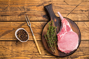 Pristine pork loin chop, featuring a thick cut and beautiful mar, a Food & Drink Photo by composter-box@mail.ru