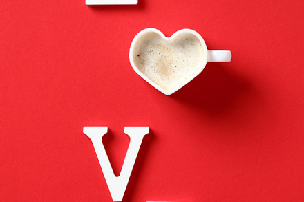 Word Love made of letters and heart shaped cup of coffee on red background Happ, a Holiday Photo by photoguns