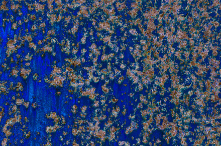Close-up of a blue painted metal surface with scattered rust pat, a Background Photo by Ales Munt