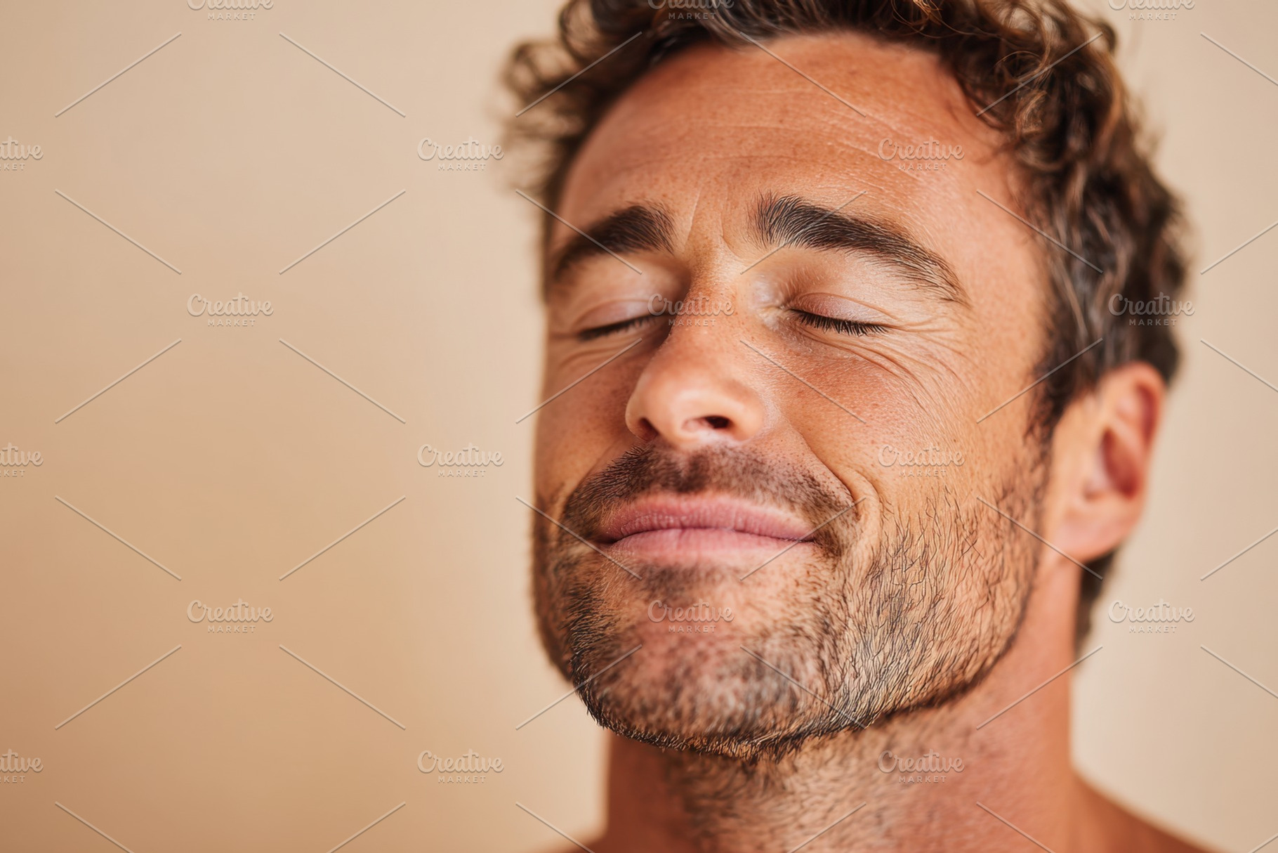 Smiling young man with beard on peach background, a Person Photo by AlyaAnd