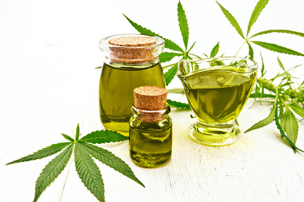 Oil hemp in gravy boat and two jars