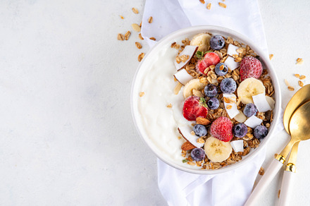 Breakfast yogurt granola bowl with fruit and berry, a Food & Drink Photo by Rimma