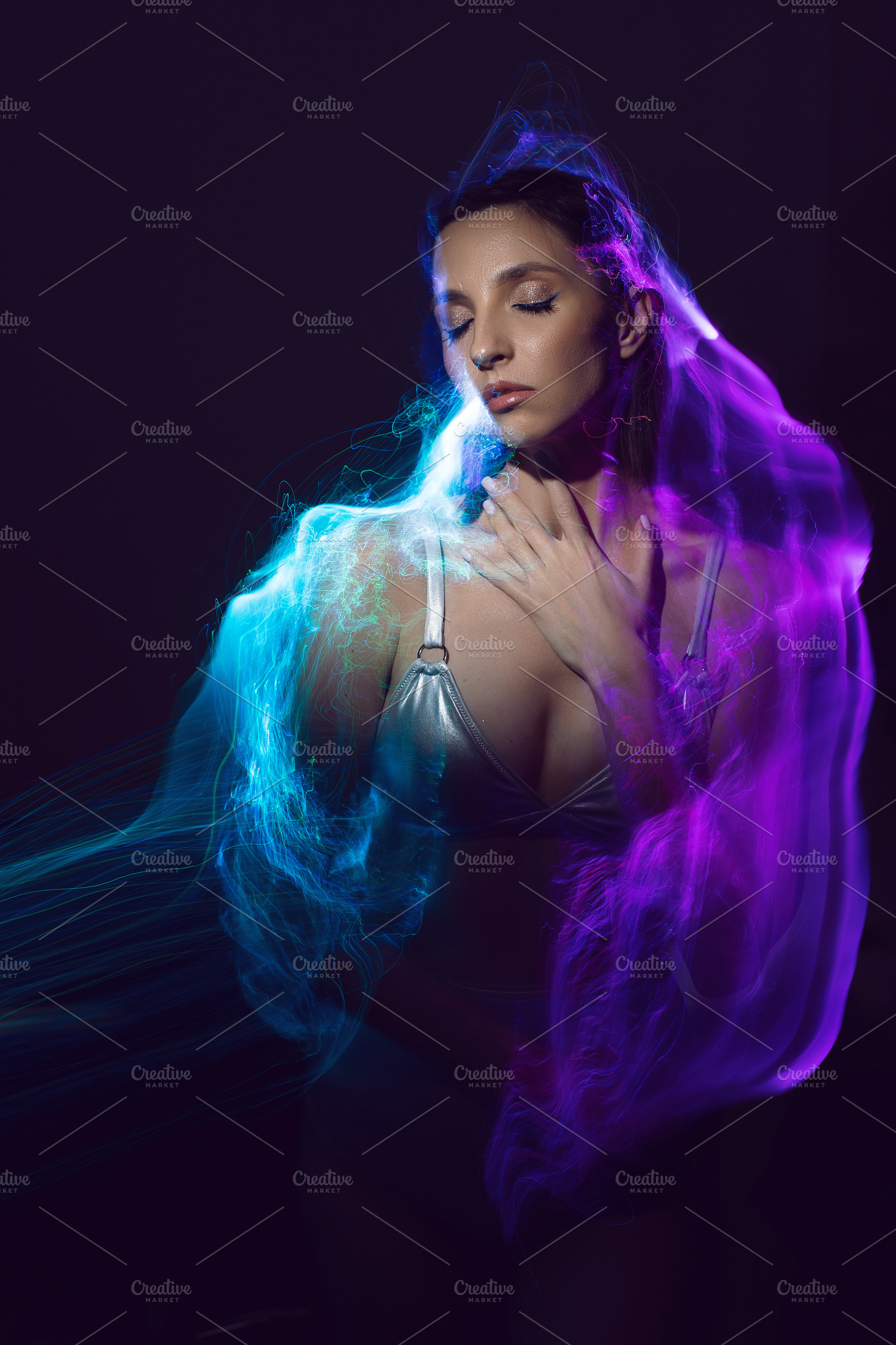portrait cyber futuristic elegant lady in a silver swimsuit vogue look isolated, a Person Photo by SaulichPhoto