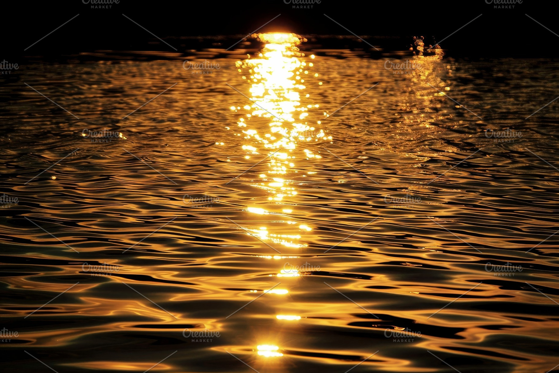 The setting sun casts reflections on, a Photo by Iftikhar Alam
