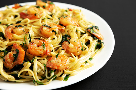 Homemade One-Pot Lemon Garlic Shrimp Pasta on a Plate on a black, a Food & Drink Photo by LiudmylaChuhunova