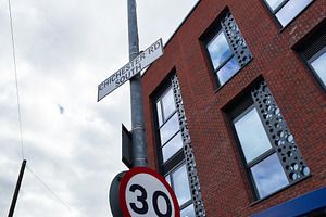 Street pole with 30 speed limit sign and Chichester Rd South nex