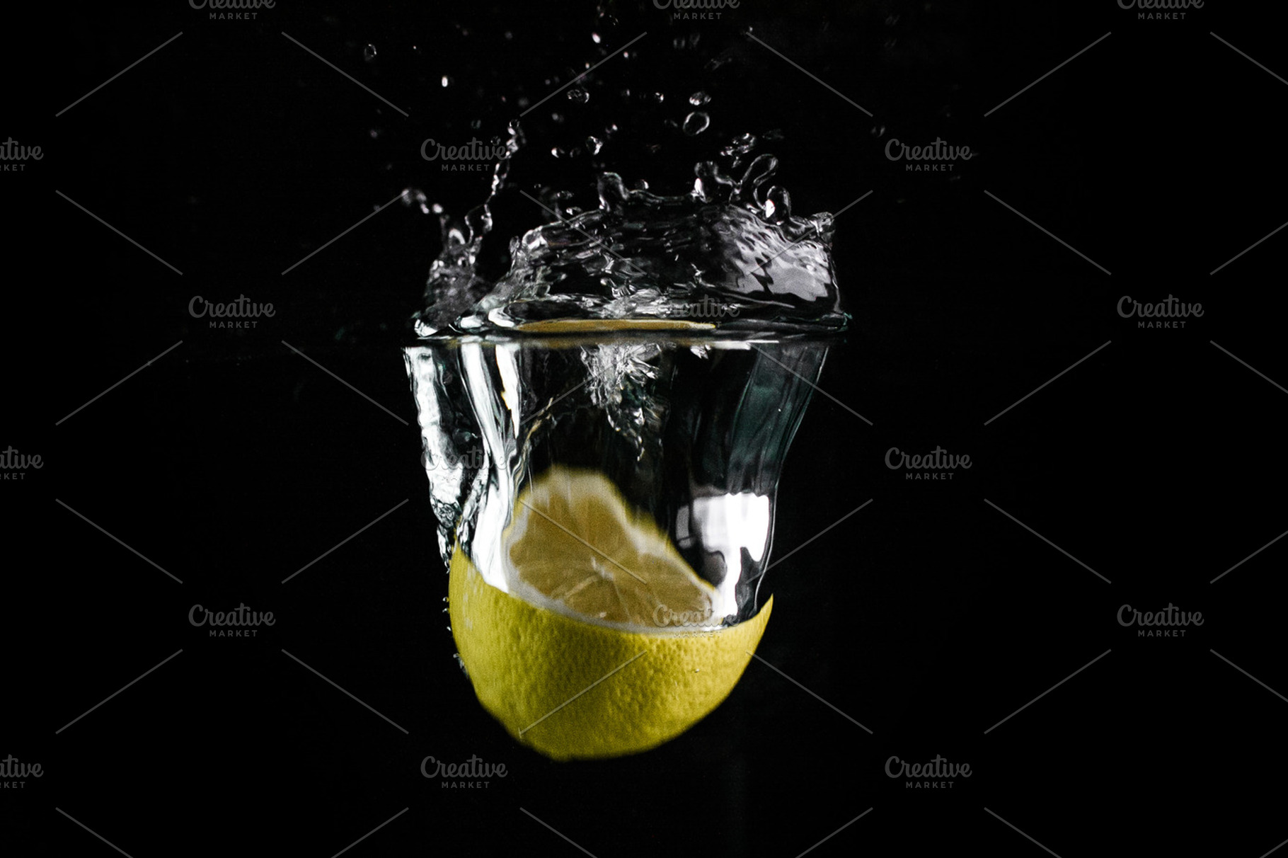 Lemon In Water Stock Photo Containing Water And Black