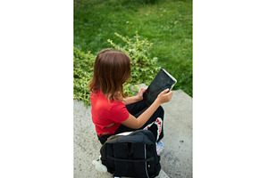 School girl enjoys free time while, a Nature Photo by IlliaBondarPhotography