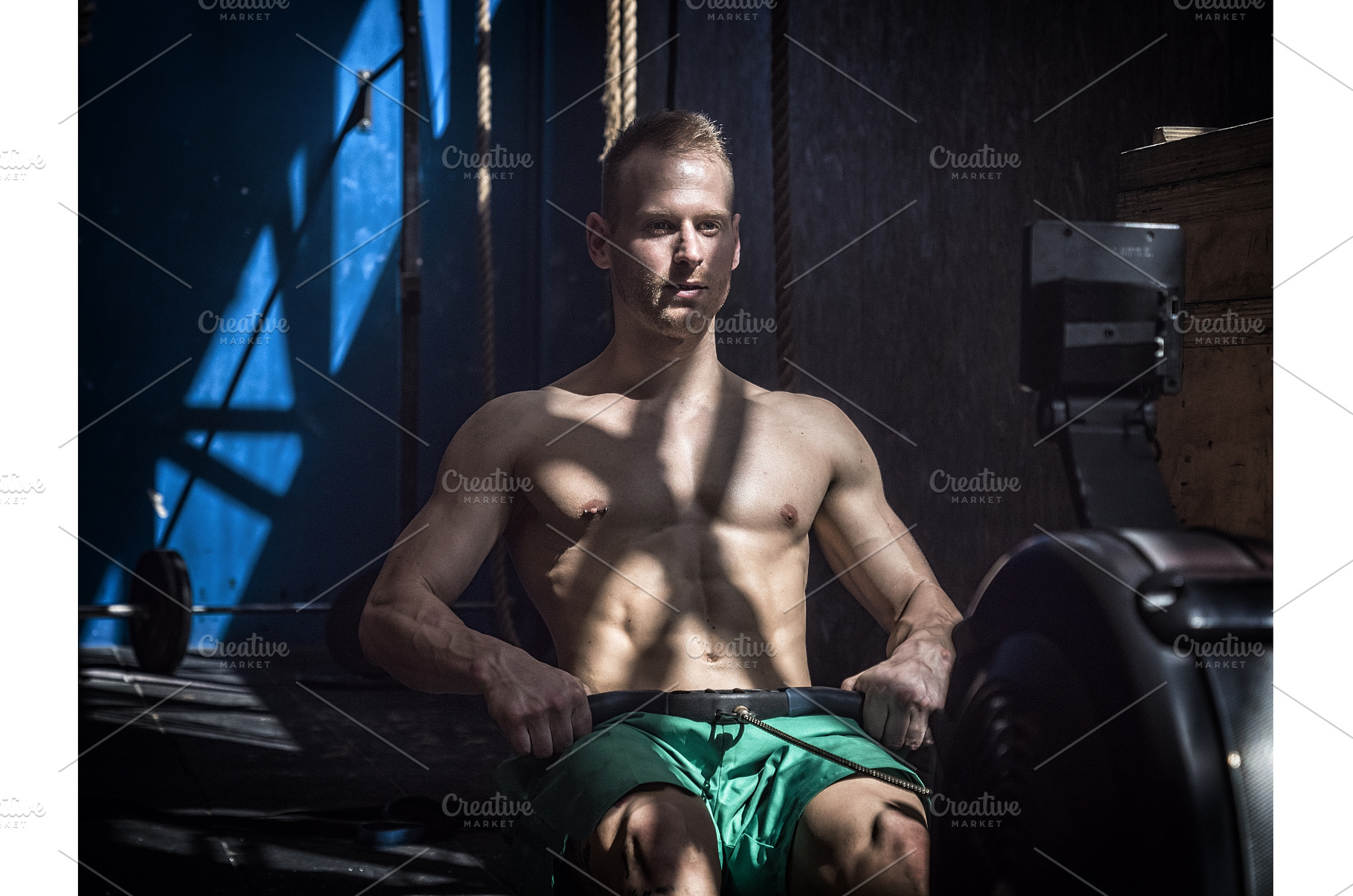 Muscular young man, training back on, a Person Photo by ArtOfPhotos photo store