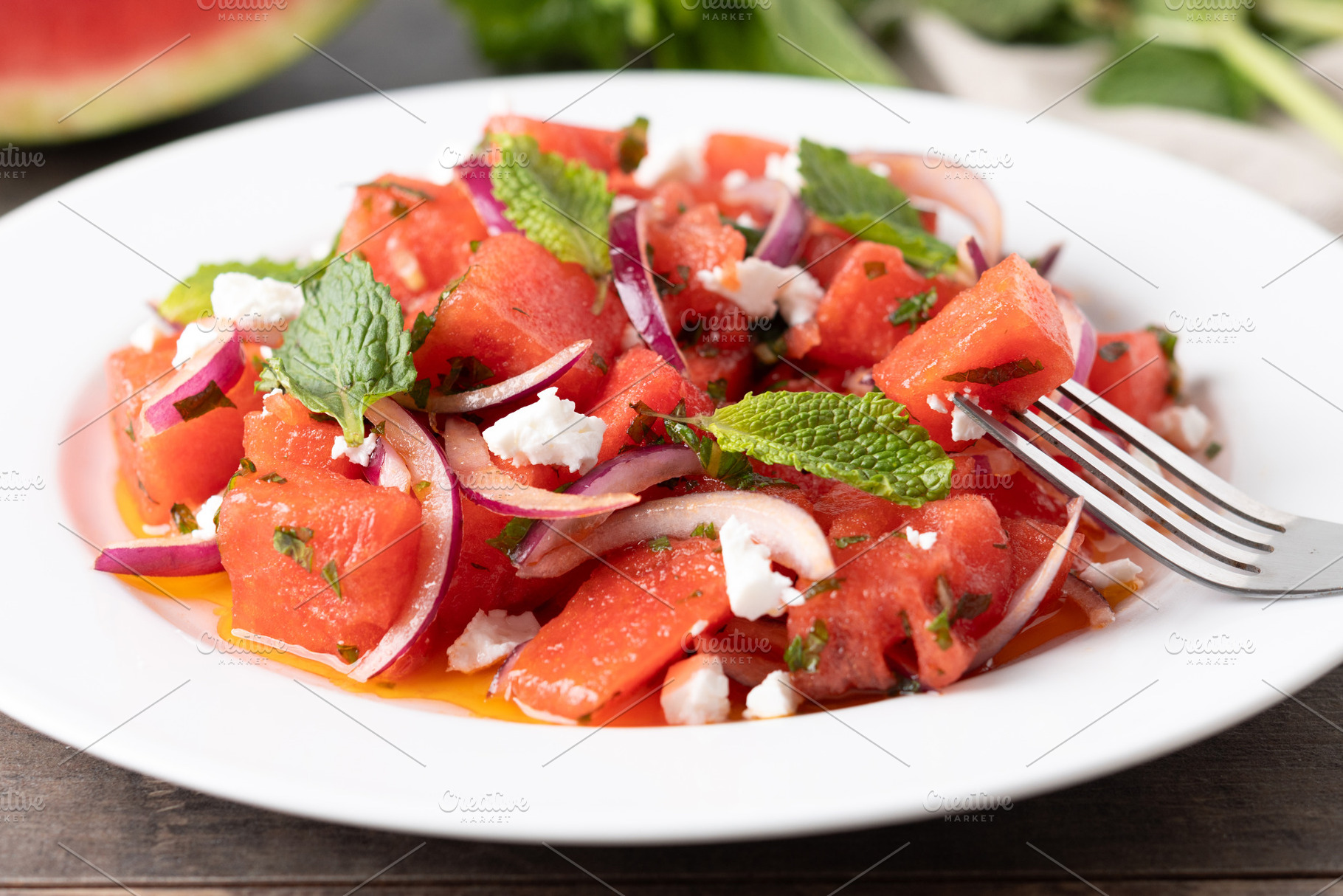 Fresh Watermelon Feta Salad with Mint and Red Onion on wooden table, a Food & Drink Photo by etorres69