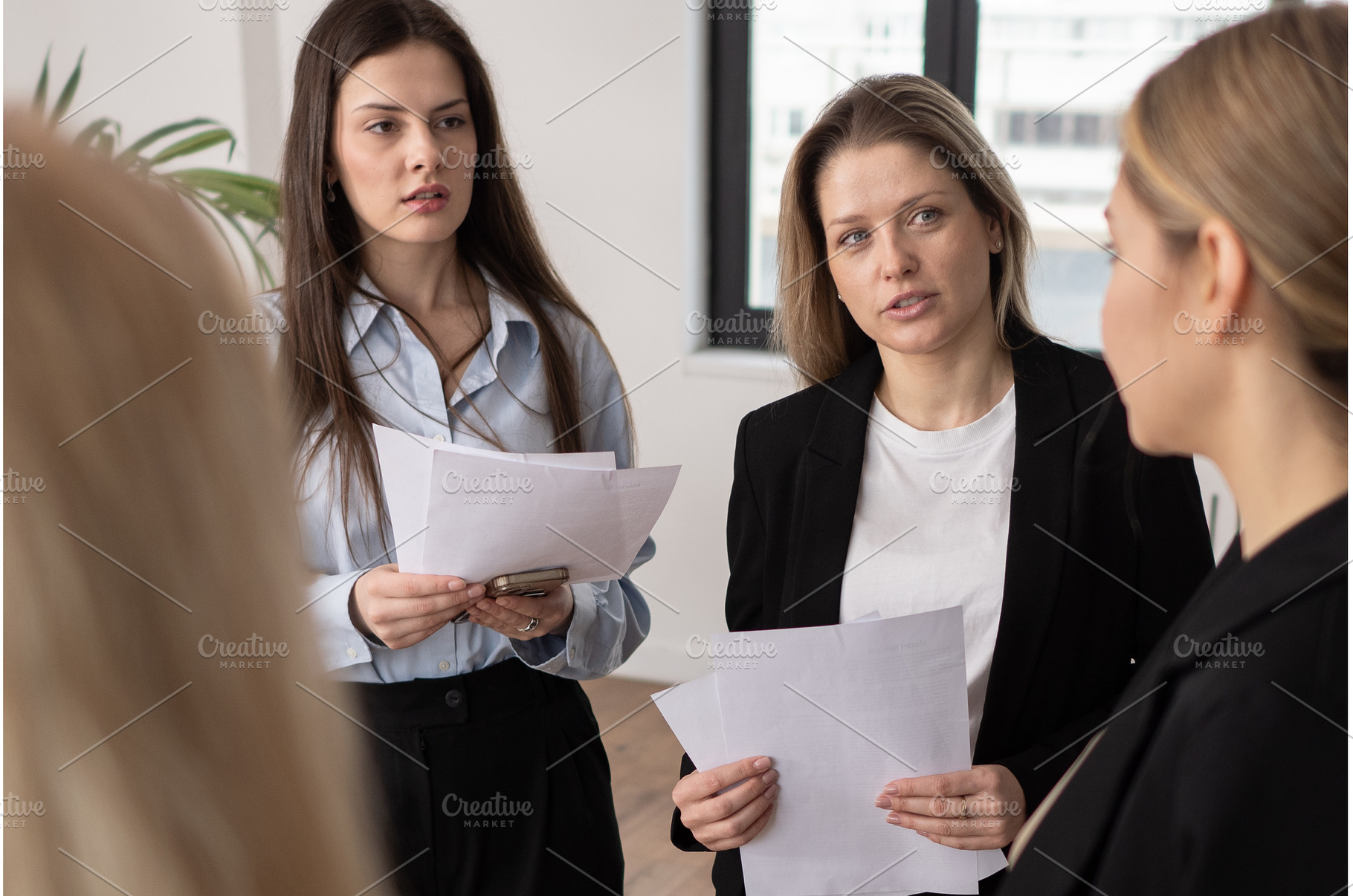 Professional women standing in, a Business Photo by undrey