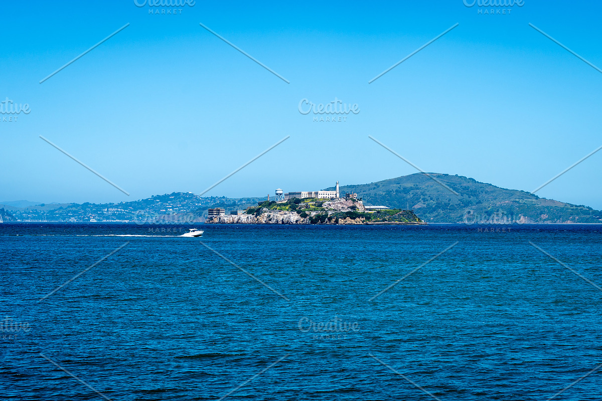 Alcatraz Island surrounded by blue waters in San Francisco Bay,, an Architecture Photo by GoodGoods (Photo 2 of 2)