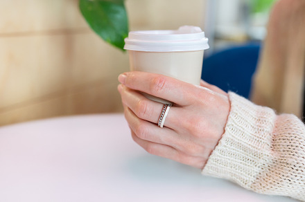 Paper coffee cup in a female hand. Coffee to go. walks in the open air., a Food & Drink Photo by Artsaba Family