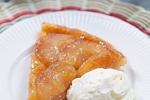 Slice of caramelized apple Tart Tartin with whipped cream, french upside down c, a Food & Drink Photo by iuliia_n