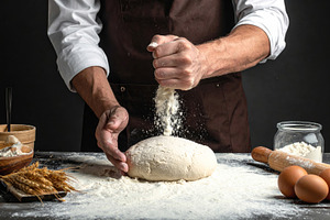 Rustic Baker Sprinkling Flour Over Fresh Dough, a Food & Drink Photo by Davizro's Market