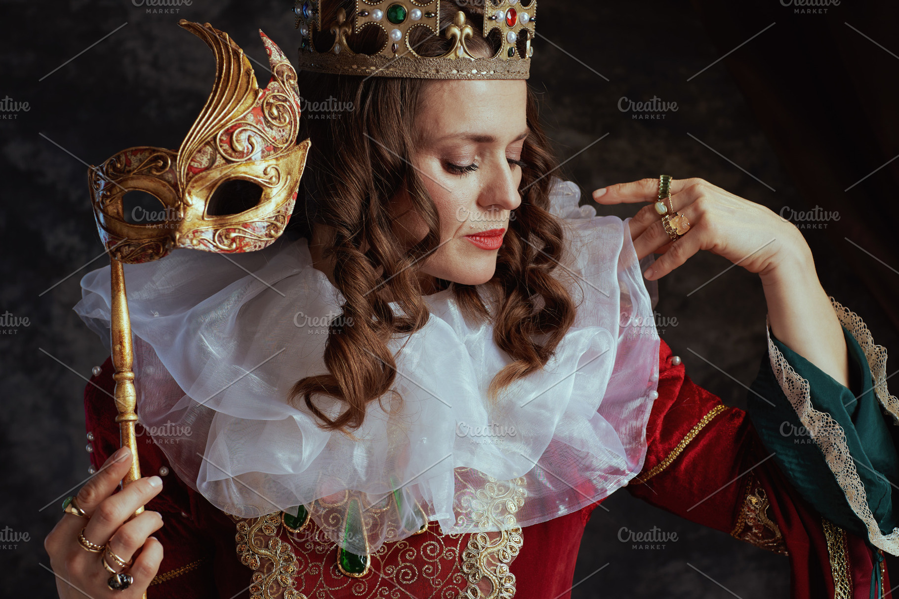 medieval queen in red dress with venetian mask, a Person Photo by Alliance Images