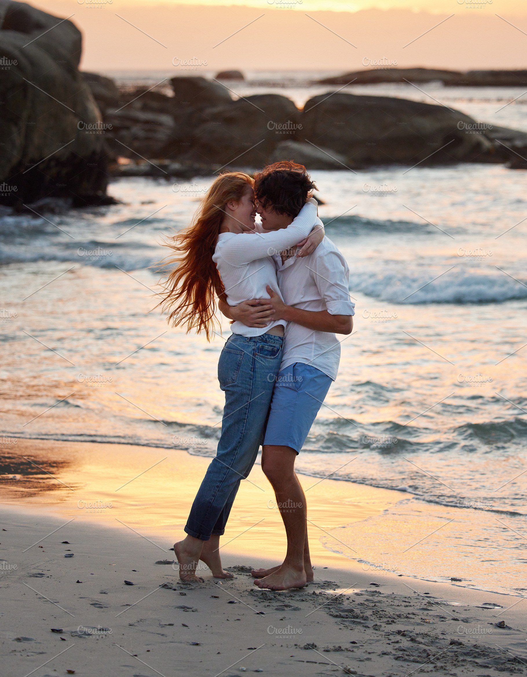 Couple hug on beach, freedom and travel, love and commitment in relationship, adventure and vacation. Trust, partnership and care with people outdoor, romance and happiness at sunset with sea waves, a Photo by Peopleimages.com