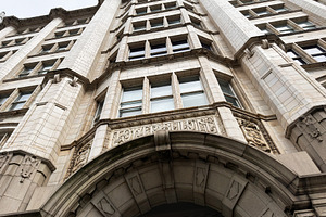 Ornate historic building facade in Liverpool, UK with arched ent