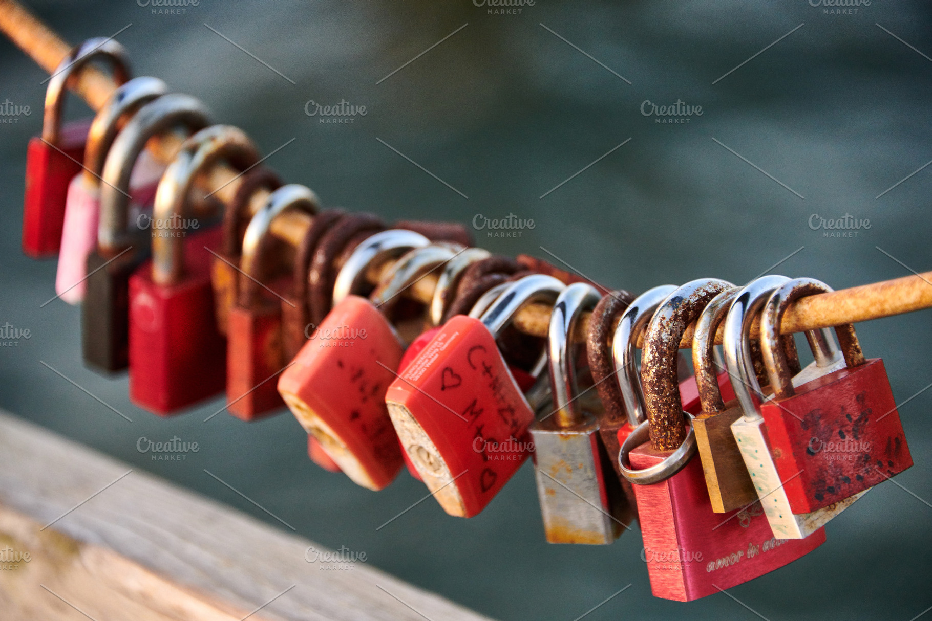 Love locks weathered on a chain on a bridge, a Nature Photo by Fotowunsch - photography 