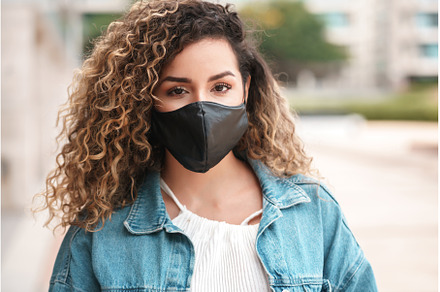 Latin woman wearing a face mask, a Person Photo by Mego-studio