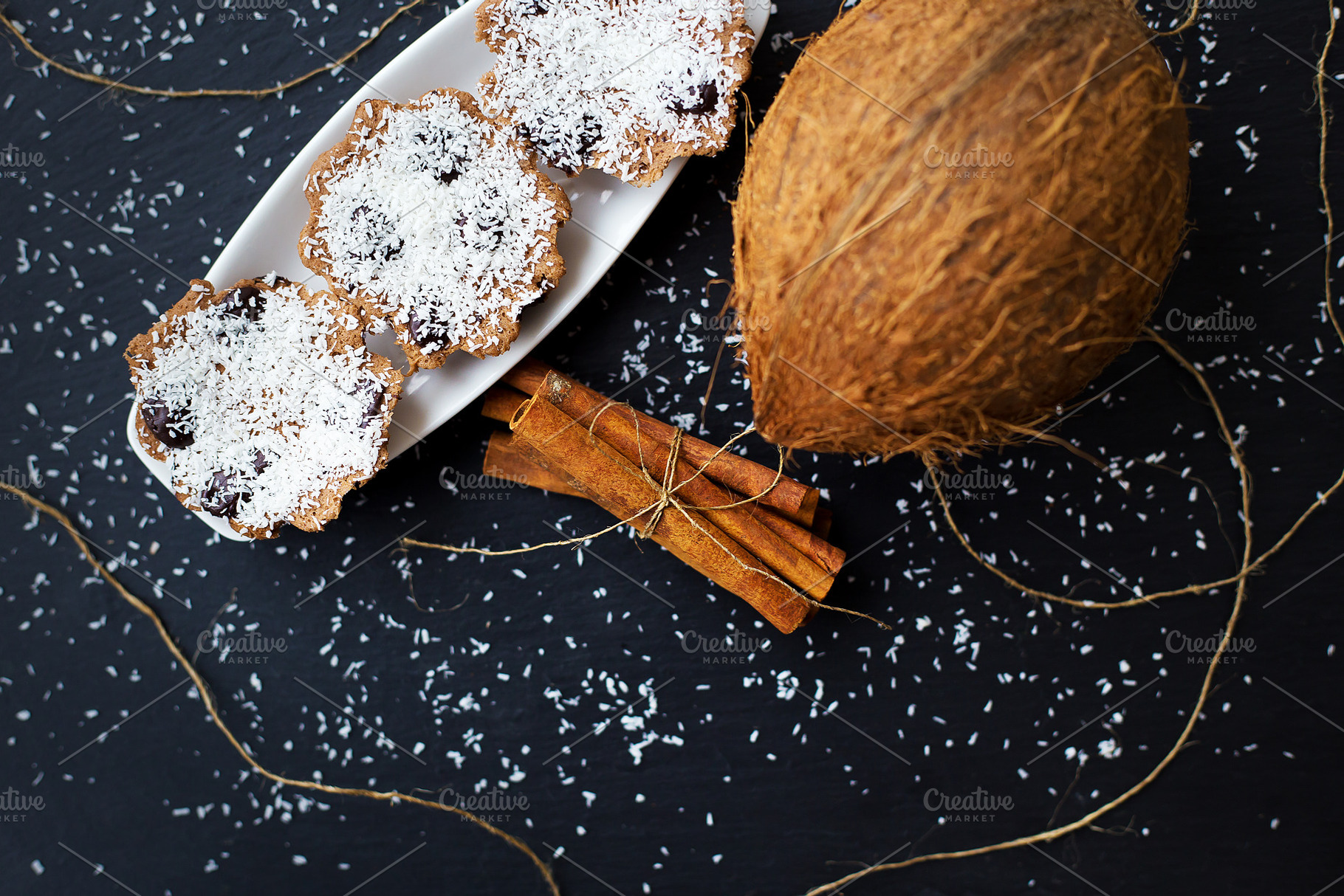 coconut muffins on a black background, a Food & Drink Photo by Artsaba Family