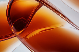 Abstract amber liquid creating elegant flowing curves with light, a Photo by Studio ANNA