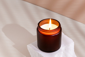 Soy wax burning candle in a dark gla, a Photo by Edalin's Store