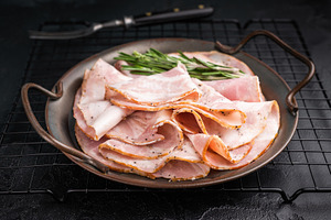 Slices of Italian Pancetta Arrotolata with rosemary in a metal d, a Food & Drink Photo by composter-box@mail.ru